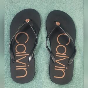 Calvin Klein Flip Flop Rose gold Signature. Black size 7/8.